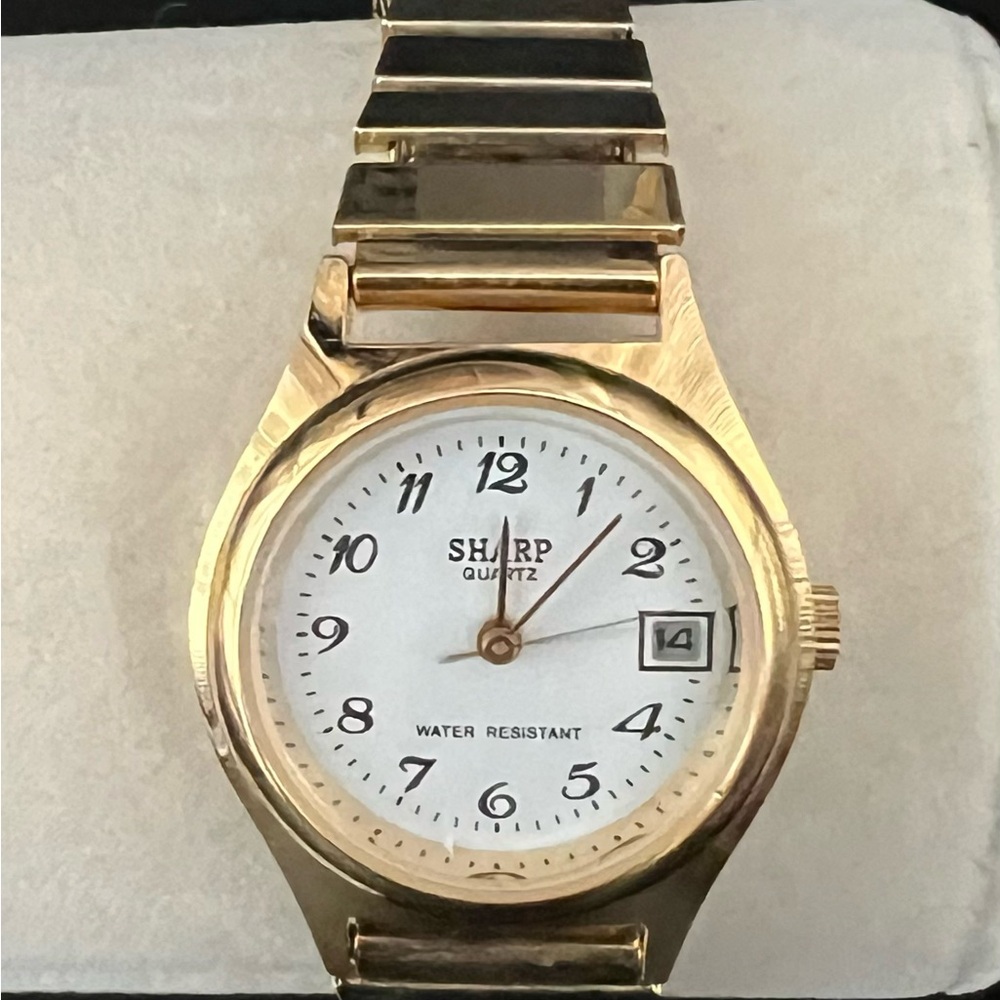Sharp Gold Smartwatch with White Face